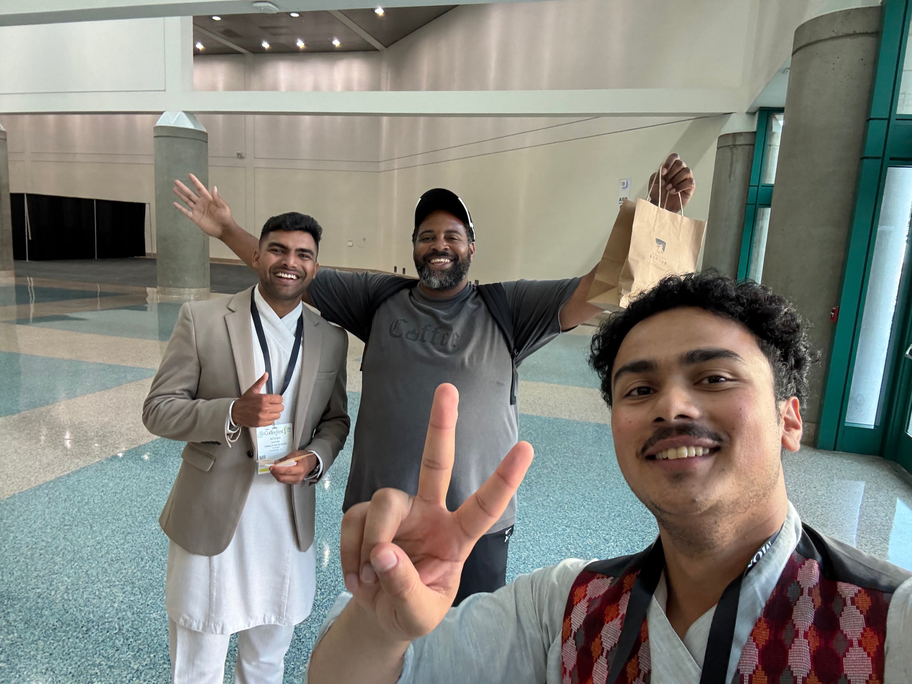 Himalayan Blends team sharing organic coffee beans and tea samples with festival attendees