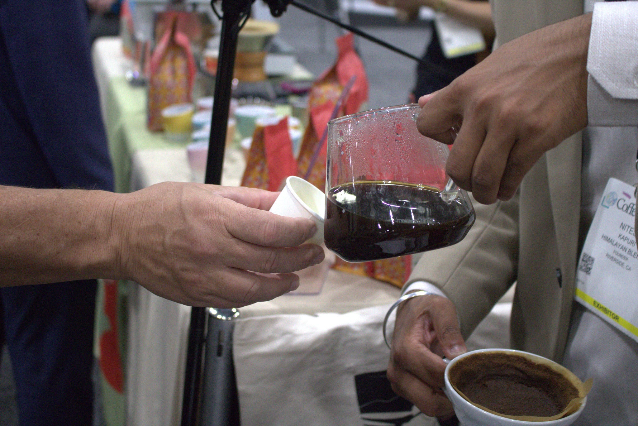 Himalayan Blends team sharing organic coffee beans and tea samples with coffee business owners.