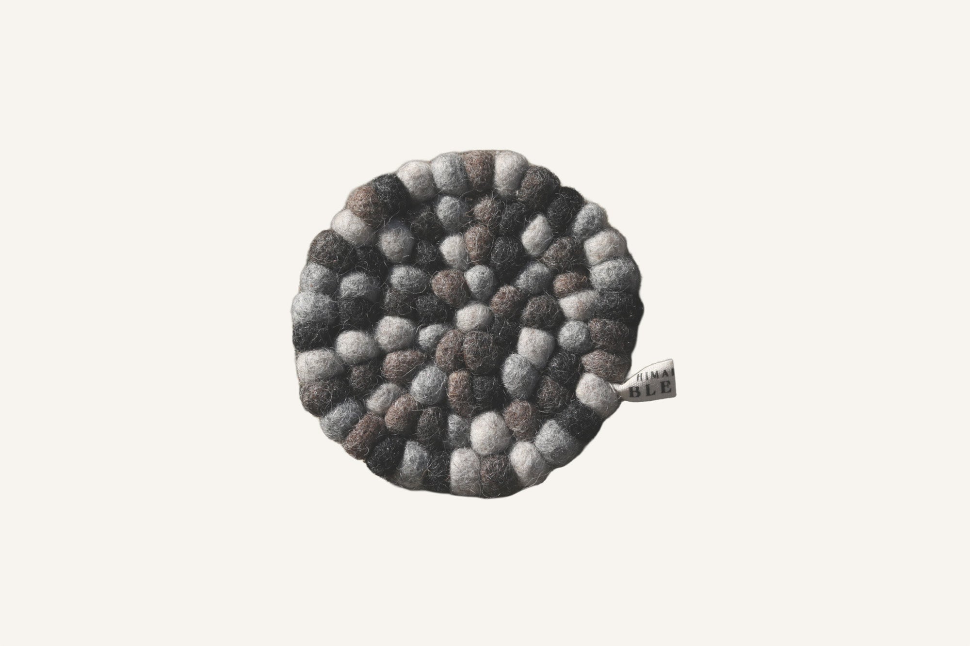 Minimal coffee and tea coaster by Himalayan Blends, designed for everyday use with coffee mugs and teacups.