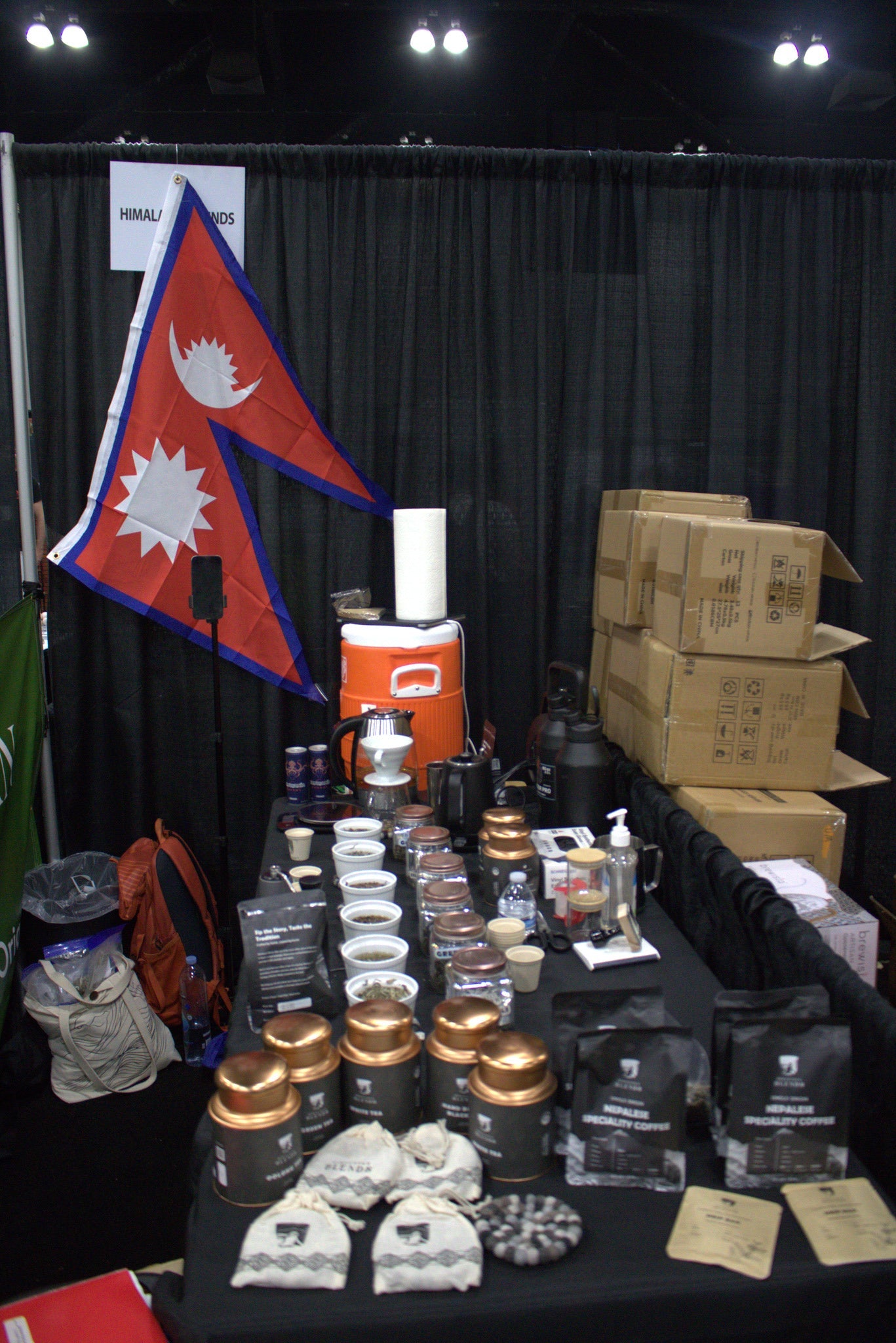 Nepal flag at Himalayan Blends booth highlighting Himalayan origin of coffee beans and tea leaves at coffee fest at Los Angeles.
