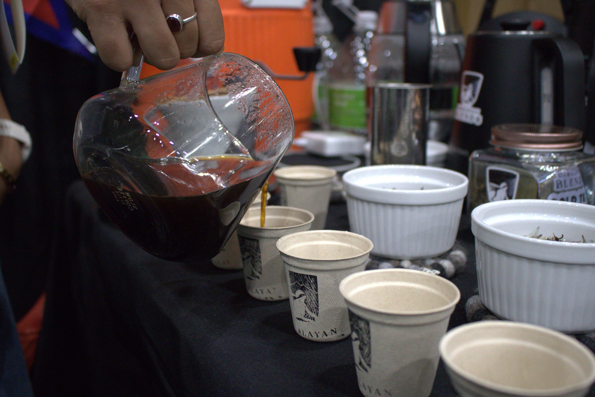 Himalayan Blends team sharing organic coffee beans and tea samples with festival attendees